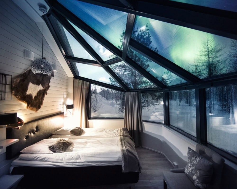 Cozy bed under a glass dome in the Arctic