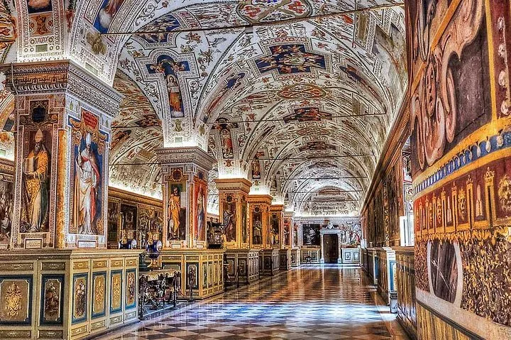 Frescoed barrel vault and marble floor in a Vatican Museums gallery hall