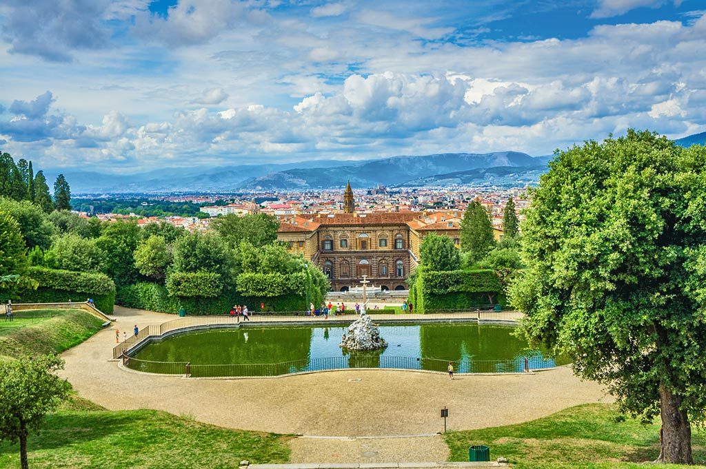 Boboli Gardens amphitheatre pond, Pitti Palace, and Florence skyline beyond the trees