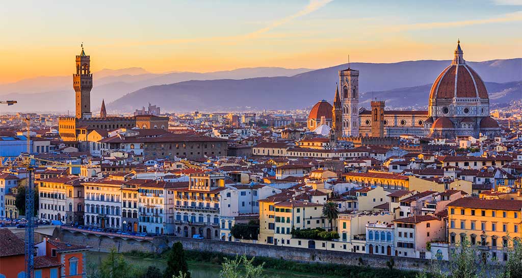 Florence skyline at sunset from Piazzale Michelangelo, with the Duomo and terracotta roofs