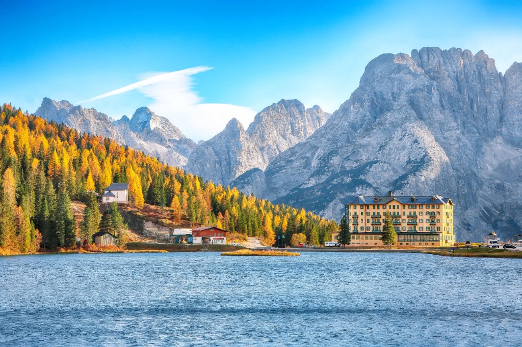 Lake Misurina with the Grand Hotel Misurina, forested shore, and jagged Dolomite peaks