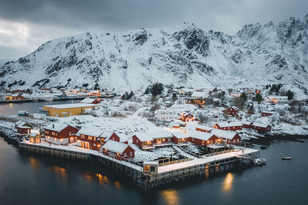Lofoten fishing village with red rorbuer on the pier