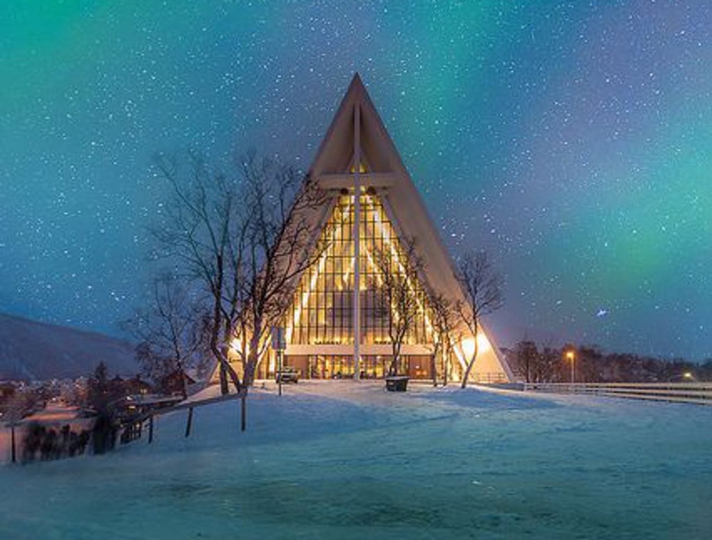 Arctic Cathedral in Tromsø at night under the aurora
