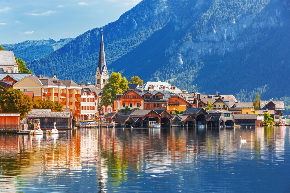 Hallstatt village reflected in its alpine lake