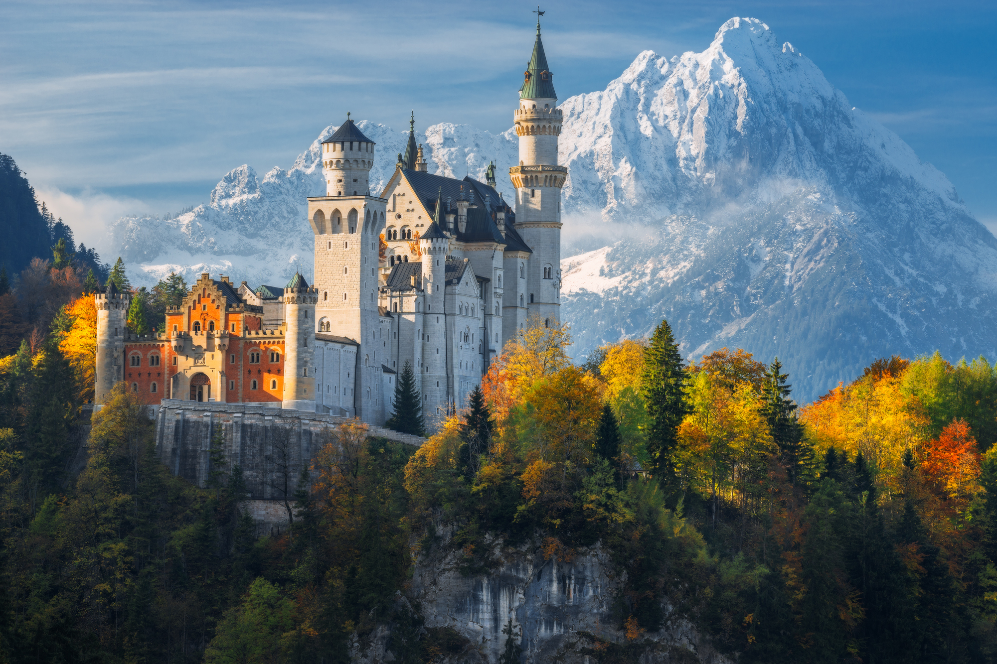 Neuschwanstein Castle above the Bavarian forest