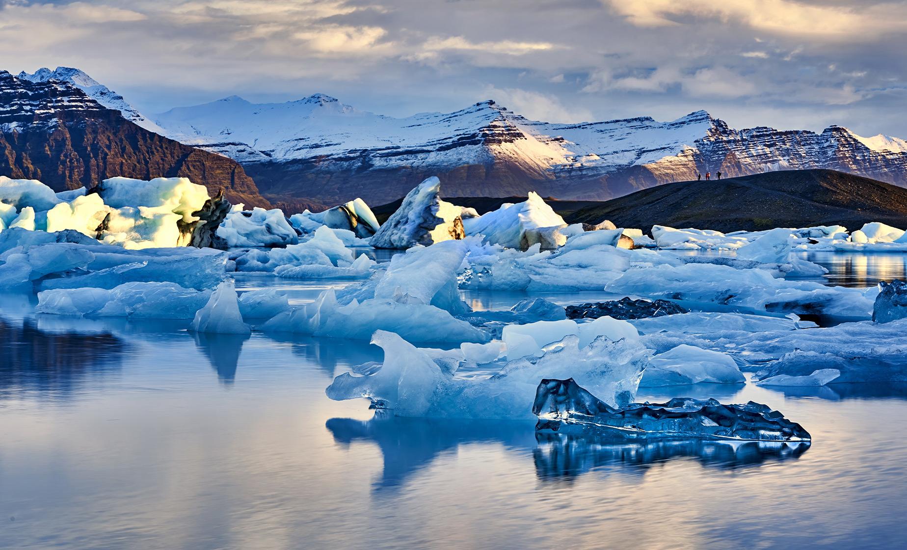 Blue ice walls inside a glacier ice cave in south Iceland