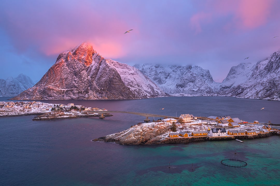 Sharp Arctic peaks above a fjord on the island of Senja