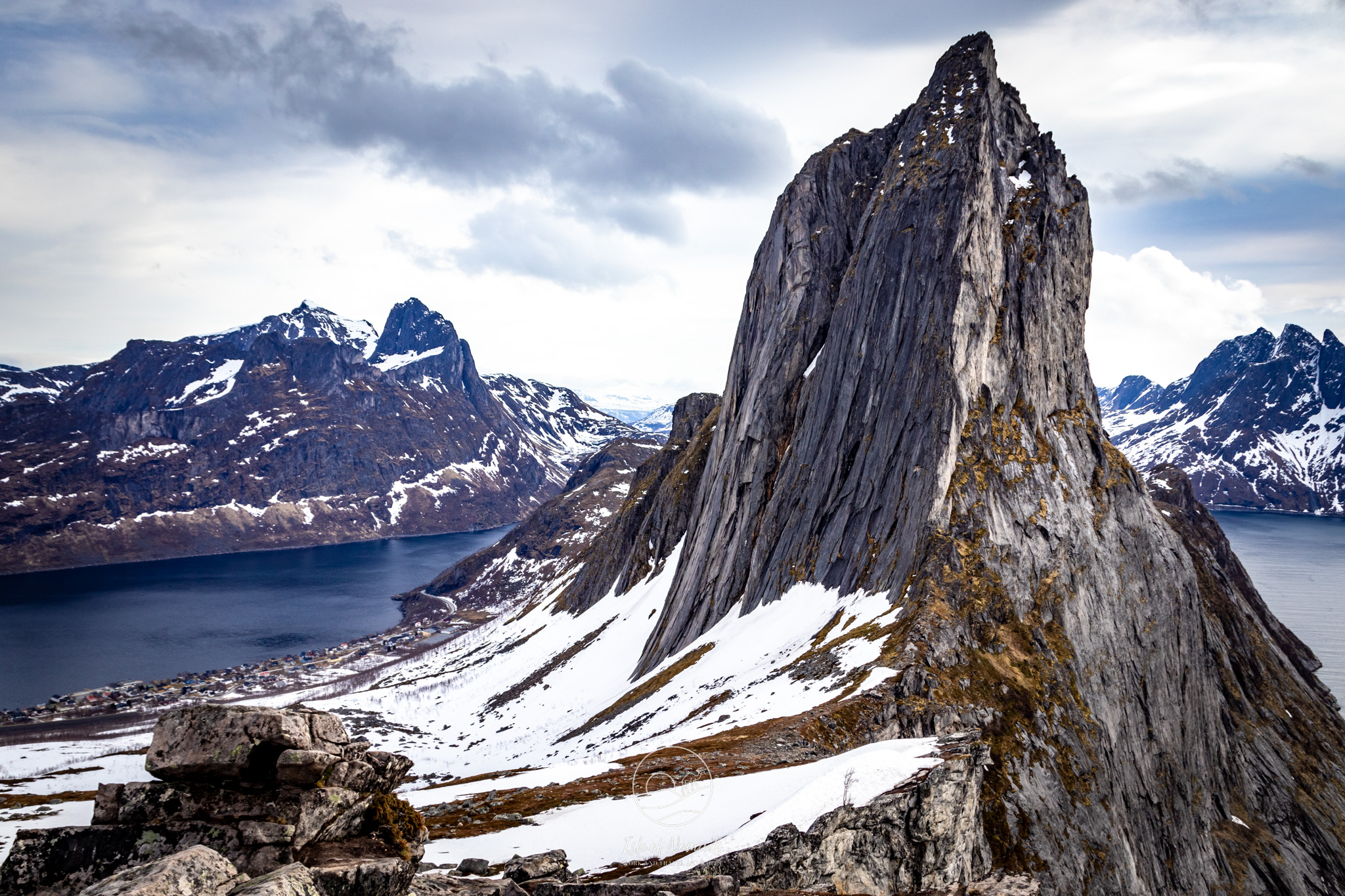Sharp mountain peaks rising above the coast of Senja